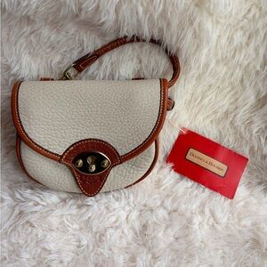 Dooney & Bourke Cream Pebbled Leather Saddle Bag with Brown Trim and coin purse